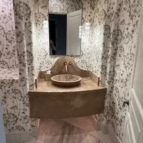 Timeless elegance meets modern charm in this beautifully designed powder room. We’ve enhanced the space with delicate floral wallpaper, creating a soft, inviting atmosphere that perfectly complements the natural stone vanity. The seamless blend of textures and patterns adds depth, proving that wallpaper is the key to transforming any room into a luxurious retreat. If you're looking for wallcoverings in Phoenix, The Wallpaper Co. is here to help you find the perfect design to bring your vision to