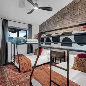 This fun and stylish bunk room strikes the perfect balance between industrial edge and cozy charm, thanks to The Wallpaper Co.'s expertly curated selection of designer wallpaper available in Phoenix. The riveted steel-look wallcovering adds bold texture and personality, turning a practical shared space into something truly memorable. It’s a great example of how thoughtful design can make even a kid’s room feel elevated and intentional.