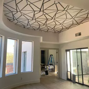 The Wallpaper Co. continues to push creative boundaries with this stunning ceiling design that instantly draws the eye upward. This expertly crafted wallpaper installation transforms the space, adding architectural interest and artistic flair to an often-overlooked surface. It’s a bold statement that redefines what’s possible with wallpaper.