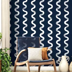 Infuse your space with playful energy and modern charm with this striking design from The Wallpaper Co. The bold navy backdrop paired with flowing white waves creates a dynamic statement wall that feels both fresh and inviting. For anyone considering a stylish upgrade, this is the perfect example of how professional wallpaper installation can completely transform a room into a design-forward retreat.