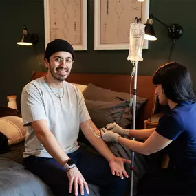 Man receiving mobile IV therapy at home in Los Angeles from a professional nurse