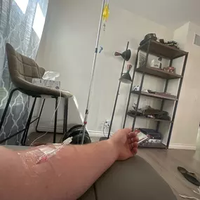 Person receiving mobile IV therapy at home in Los Angeles for hydration and recovery.