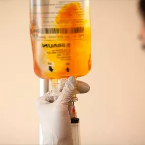 Close-up of a mobile IV nurse preparing a vitamin infusion drip in Los Angeles.