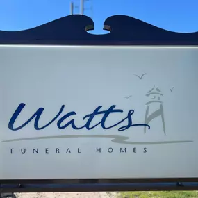 Experience the welcoming, compassionate atmosphere at Watts Funeral Homes. Our distinctive outdoor sign, featuring elegant script and a lighthouse, represents our commitment to guiding families with dignity and respect.