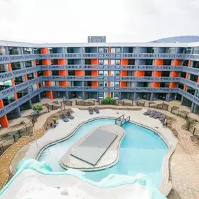 A top-down view of the swimming pool at Passenger Flats in Chattanooga, surrounded by the apartment buildings.