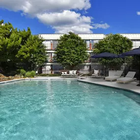 A refreshing swimming pool at Passenger Flats in Chattanooga with a relaxing outdoor atmosphere.