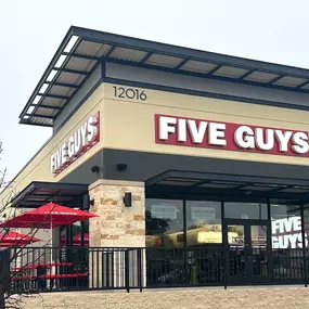 Exterior photograph of the Five Guys restaurant at 12016 Alamo Ranch Parkway in San Antonio, Texas.