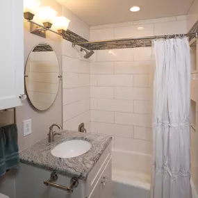 ZimmTown Construction’s bathroom remodel features sleek fixtures, elegant tilework, and modern lighting. A spacious vanity, custom storage, and a beautifully tiled shower create a stylish and functional retreat designed for comfort and relaxation.