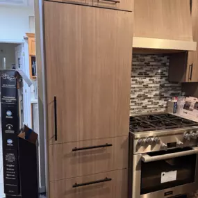 Fully installed panel-ready refrigerator blends seamlessly into the kitchen cabinetry at the Voss showroom.