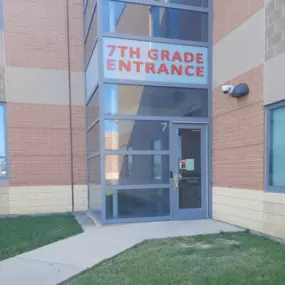 This is a sign we created for Princeton Schools in Springdale. It identifies the 7th grade entrance at the middle school. We designed it to fit between the aluminum frame for the windows above the door. Do you have a difficult area where you need a sign? Visit our Facebook page to see examples of our work, and call for a free consultation.