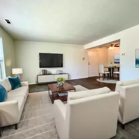 Living room with a couch and a coffee table and a television