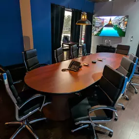 A glimpse into FreeCast, Inc.'s executive conference room, designed for high-level meetings, digital strategy planning, and media production discussions.