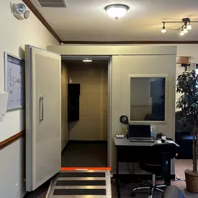 Interior photo of the hearing testing booth in the AudioNova hearing clinic in Fort Wayne, IN