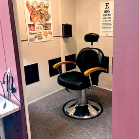 Interior photo of the hearing testing booth for AudioNova hearing clinic in Grand Rapids, MI