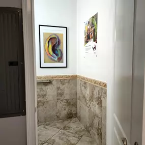 Interior photo of the bathroom for AudioNova hearing clinic in Jupiter, FL