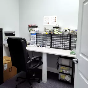 Interior photo of the hearing aid lab for AudioNova hearing clinic in Jupiter, FL