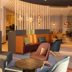 Hotel lobby of Adagio Access Brussels airport, a newly build hotel with a colourful retro interior.