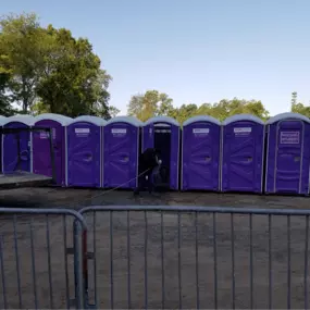 John To Go Porta Potties and barricade fence