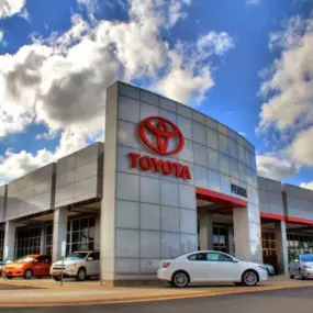 Peoria Toyota dealership exterior with Toyota models parked around it