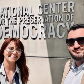 Impact Ventures International x The National Center for the Preservation of Democracy

This dynamic and inspiring photo captures Joshua Kirshbaum and Kelly Grandmaison, co-founders of Impact Ventures International (IVI), during a project with the National Center for the Preservation of Democracy in Downtown Los Angeles.
Photo Breakdown & Visual Elements:

???? Backdrop: The duo stands in front of the center’s bold, modern signage, emphasizing the mission-driven focus of their visit.
☀️ Bright Li