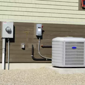 High-efficiency residential HVAC unit installed on a concrete platform outside a home, ensuring optimal heating and cooling performance. Professionally connected to the electrical and piping system for energy-efficient climate control. MAX Comfort HVAC specializes in expert HVAC installation, repair, and maintenance services in Allentown, PA, delivering reliable and cost-effective solutions for homes and businesses.