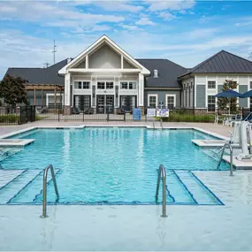 A large swimming pool in front of a building