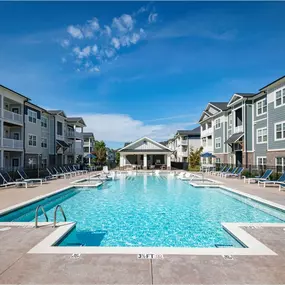 A large swimming pool in front of apartment