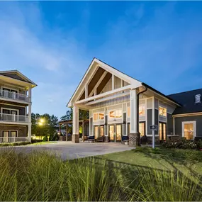 A modern house with a spacious front yard and a well-maintained lawn