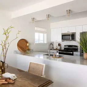 Open space & kitchen with quartz countertops