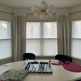 Light, layered, and lovely! ✨ These Tri-Shades combine sheer and cellular shades for a soft, stylish look that lets in daylight while keeping privacy in check. A perfect fit for this bright and cozy dining nook! ☀️????