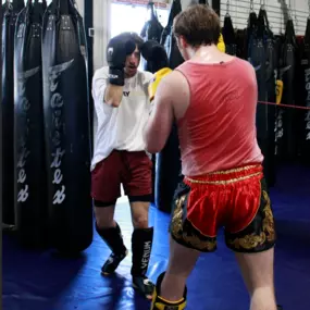 Muay Thai Kickboxing is an effective method of self-defense developed by the Siamese army during the medieval ages in Thailand. It is globally recognized as an extremely effective form of hand-to-hand combat and an incredible way to get in shape fast! If you’re looking for a great cardio workout and also want to learn real fighting techniques, the Muay Thai Kickboxing program at McMahon Training Center in Fort Collins is the right place for you!