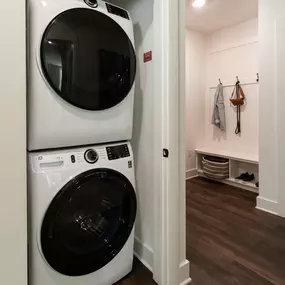 Stackable washer and dryer near mudroom entry at Camden West Nashville apartments in Nashville, TN