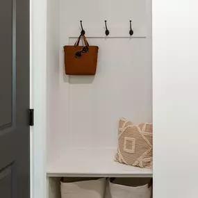 Mudroom entry with hooks and bench seat at Camden West Nashville apartments in Nashville, TN