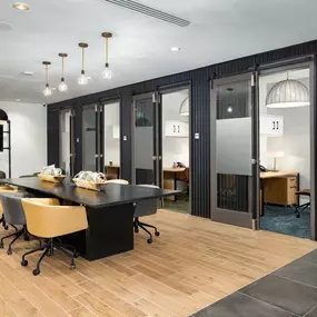 Community workspace with individual co-work office spaces at Camden West Nashville apartments in Nashville, TN