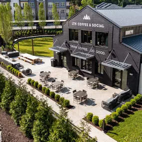 Patio with seating outside the onsite coffee shop and cafe at Camden West Nashville apartments in Nashville, TN