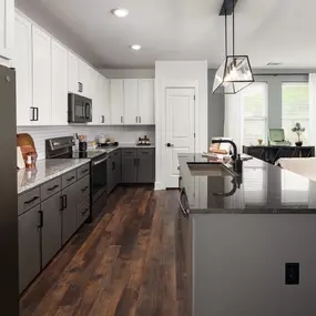 Spacious kitchen and living area with modern finishes at Camden West Nashville apartments in Nashville, TN