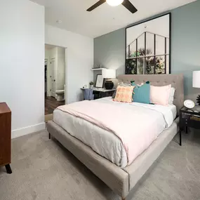 Bedroom with carpet, ceiling fan, and ensuite bathroom at Camden West Nashville apartments in Nashville, TN