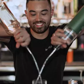 Bartender making a cocktail at wasted grain in Old Town Scottsdale