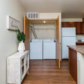 a kitchen with white appliances and a counter top