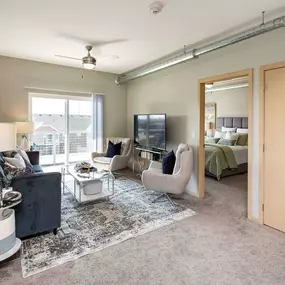 Living room with spacious closet, sofa, chairs