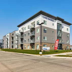 Lake Shore Apartments building with surface parking