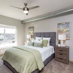 Furnished bedroom with large windows
