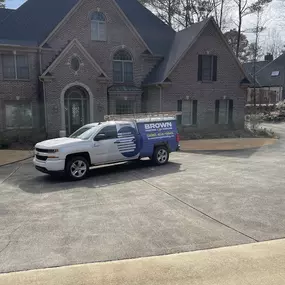 brown work truck at a customers house