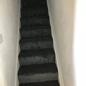 Black carpet fitted on a staircase