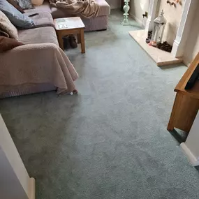 Mint green carpet fitted in a lounge