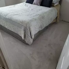 Beige carpet fitted in a bedroom