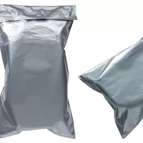 A set of three gray poly mailers shown in different positions, illustrating their flexible and secure packaging design. One mailer is displayed flat, while the others are filled and sealed, demonstrating their ability to conform to the contents inside. These lightweight yet durable mailers provide water-resistant, tear-proof protection, making them ideal for e-commerce shipping, apparel, and soft goods.