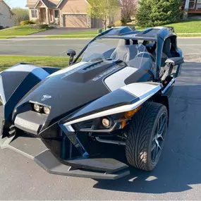 The Fun Machine
Polaris Slingshot shining in the driveway—proof that rewards come in all shapes... especially 3-wheeled ones.