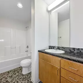 Bathroom with bathtub, mirror & sink