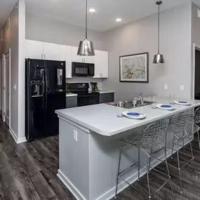 Kitchen with appliances & microwave